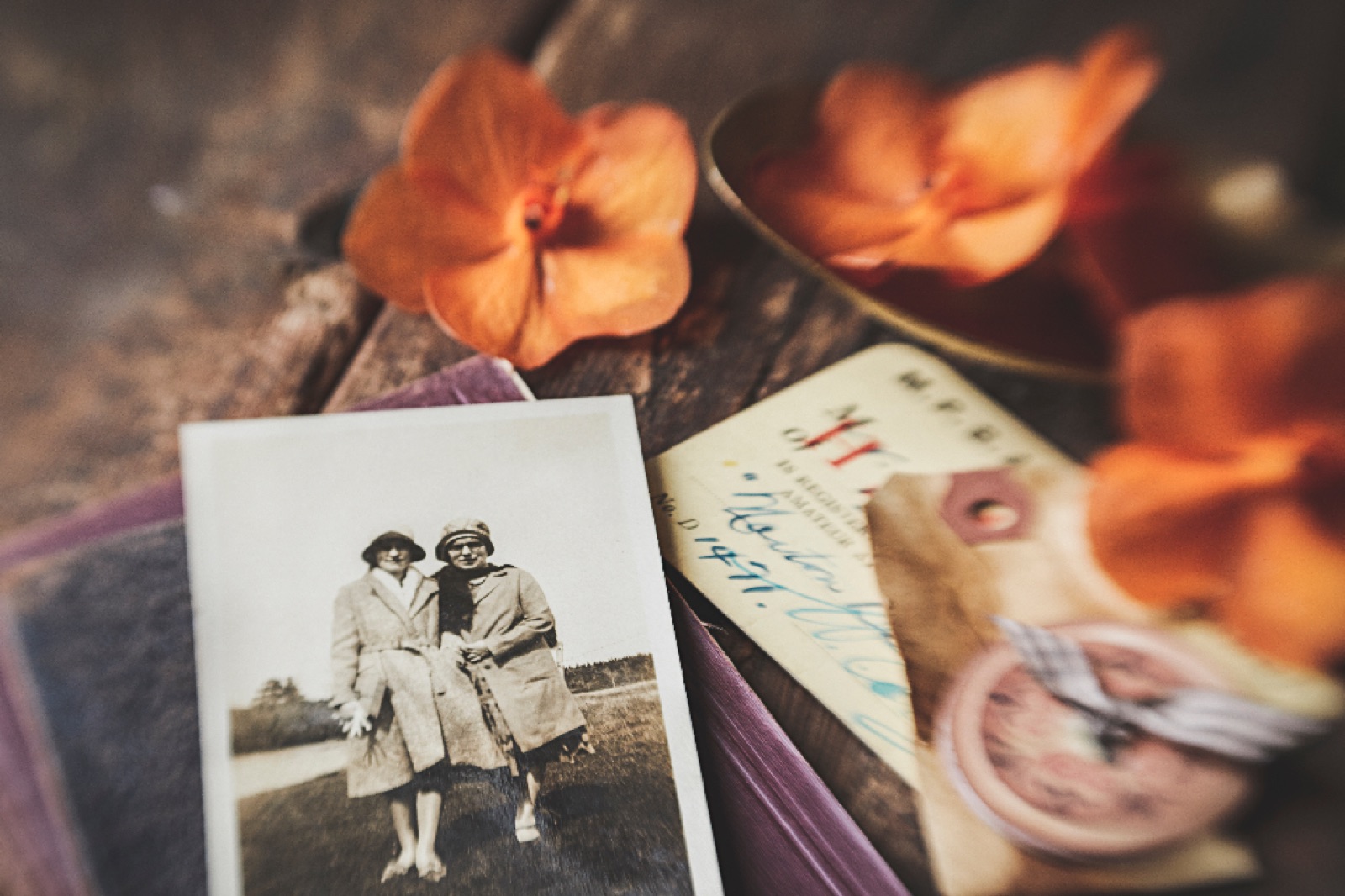 Old family photograph and keepsakes, representing sorting belongings in an inherited home