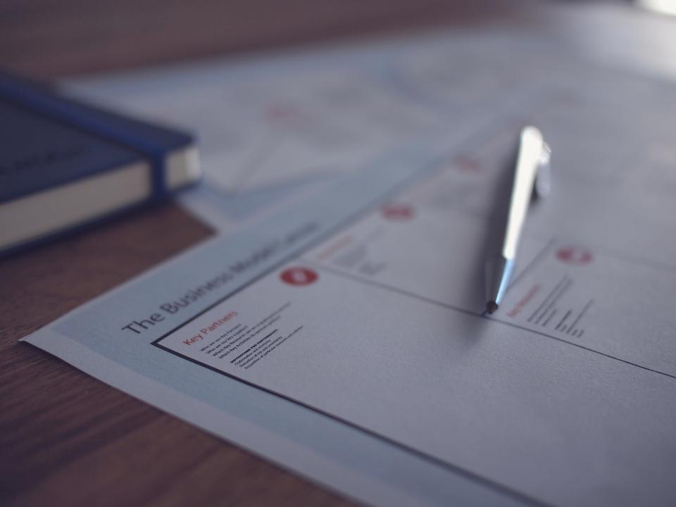 Pen resting on a legal form ready to sign