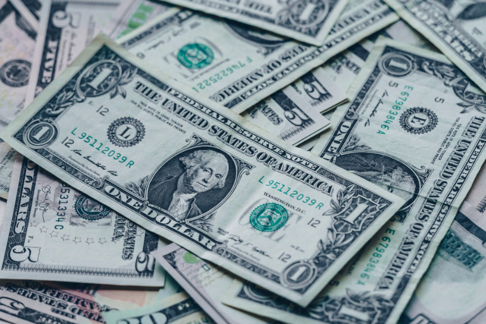 Pile of dollar bills representing a mortgage payoff